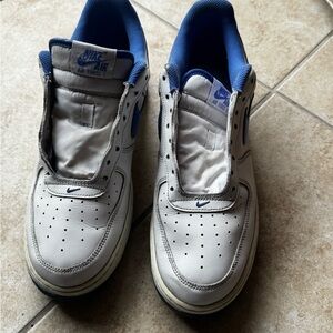 Nike Men’s White and Blue Leather Sneakers